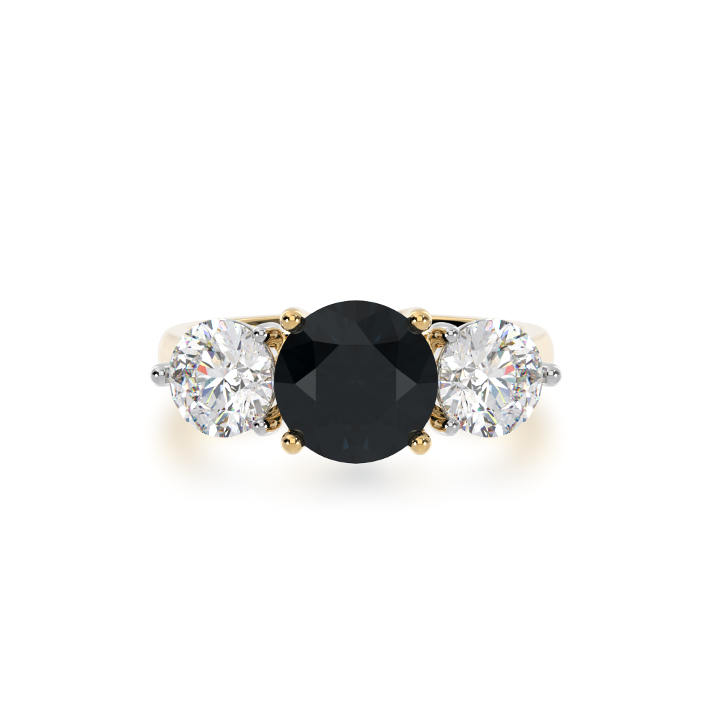 Trilogy round brilliant cut black sapphire and diamond ring on yellow band