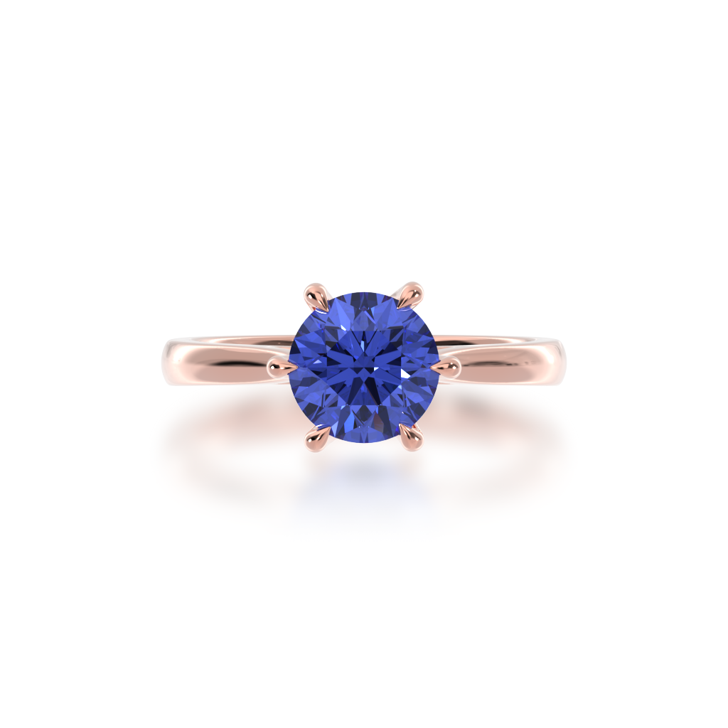 Round brilliant cut blue sapphire solitaire ring on rose gold band