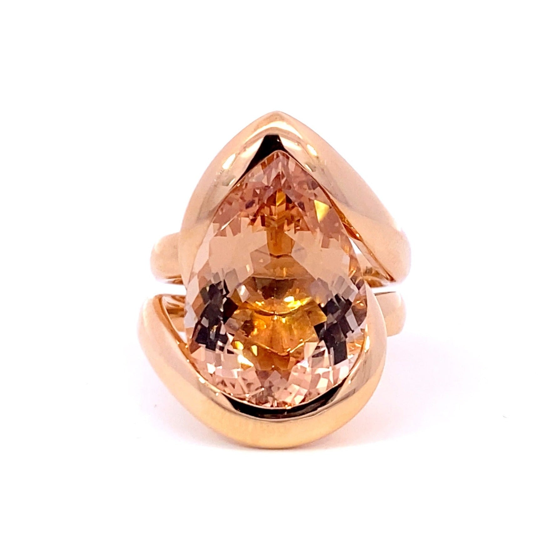 Pear shaped champagne peach coloured morganite ring in infinity