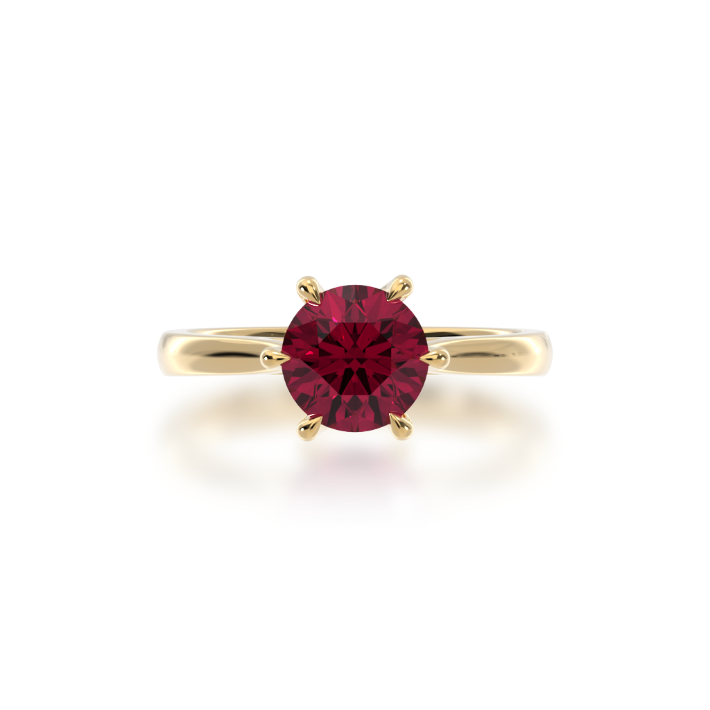 Brilliant cut ruby solitaire on a yellow gold band from top