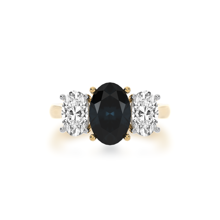 Trilogy oval cut black sapphire and diamond ring on yellow gold band view from top
