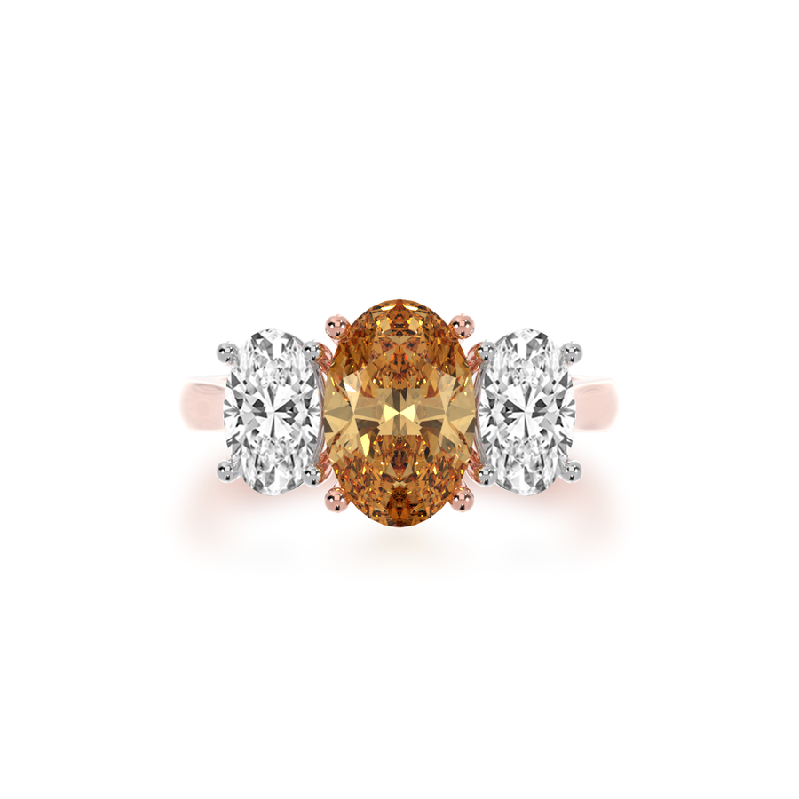 Trilogy oval cut champagne and diamond ring on rose gold band view from top