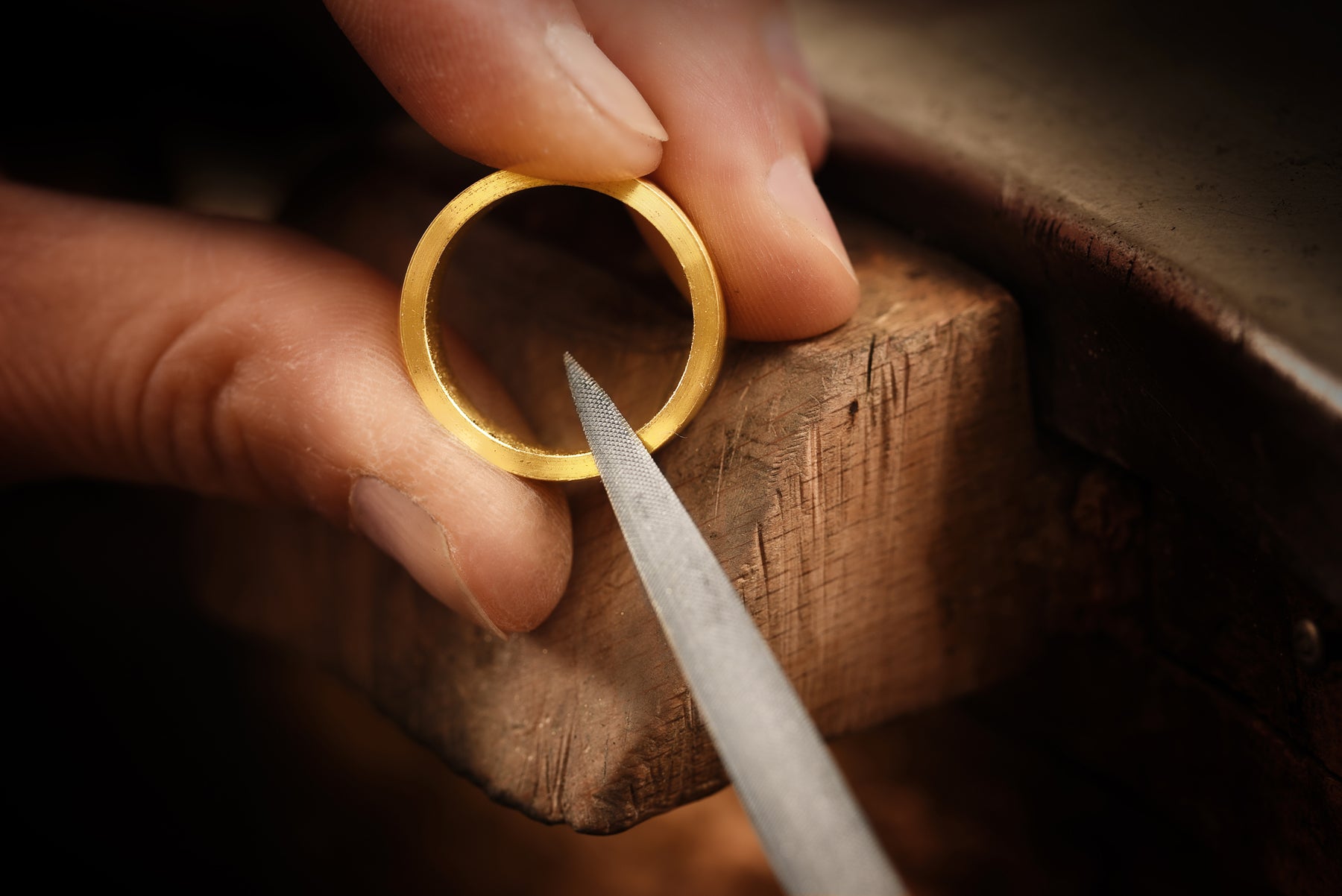 Close up of Gold ring being inspected before it is recycled to new gold jewellery