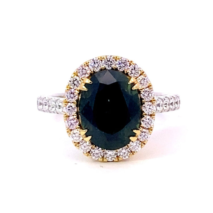 Oval cut green sapphire diamond halo ring with diamond band