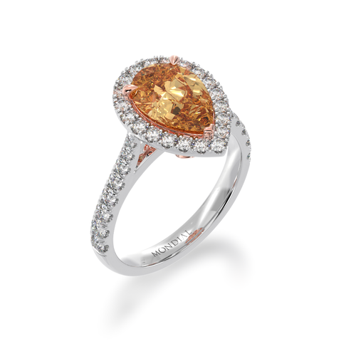 Pear shape champagne diamond halo engagement ring with diamond set band view from angle