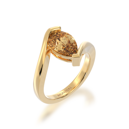 Pear shaped champagne diamond solitaire set in yellow gold bordeaux design ring view from angle