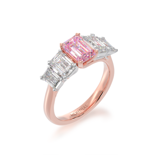 Five stone emerald cut pink sapphire and diamond ring on rose band view from angle