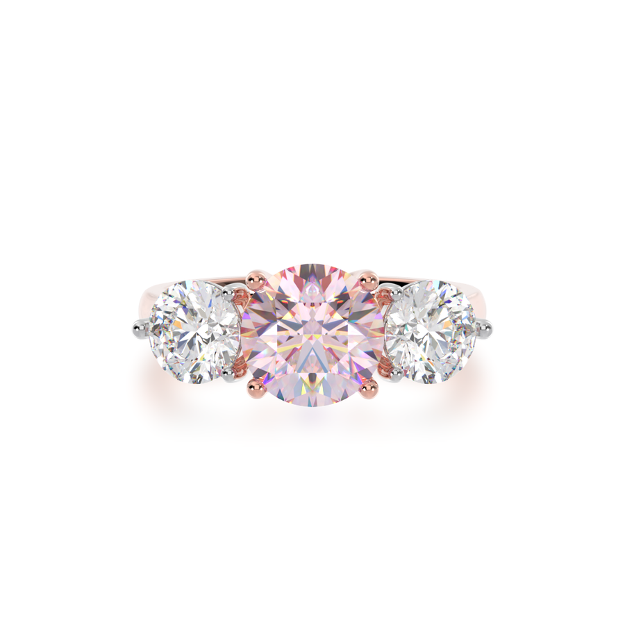 Trilogy round brilliant cut pink sapphire and diamond ring on rose gold band view from top