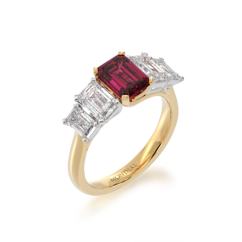 Five stone emerald cut ruby and diamond ring on a yellow gold band view from angle