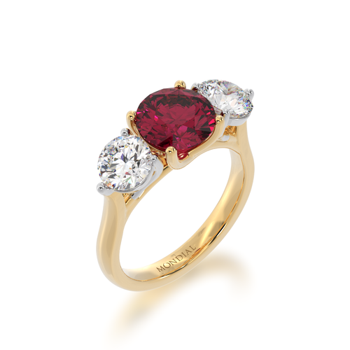 Trilogy round brilliant cut ruby and diamond ring on yellow gold band view from angle