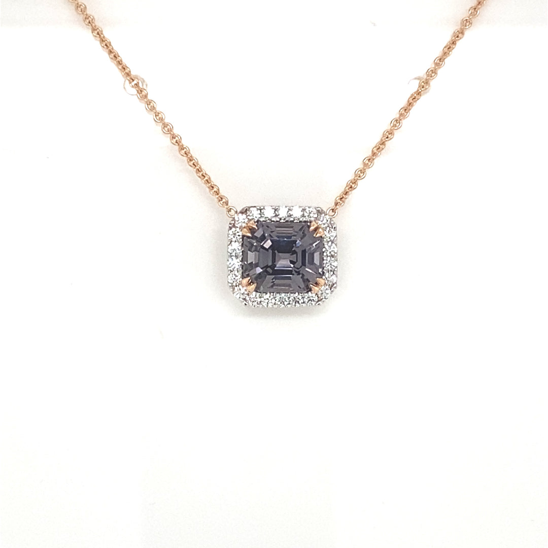 Emerald cut spinel and diamond halo pendant view from front