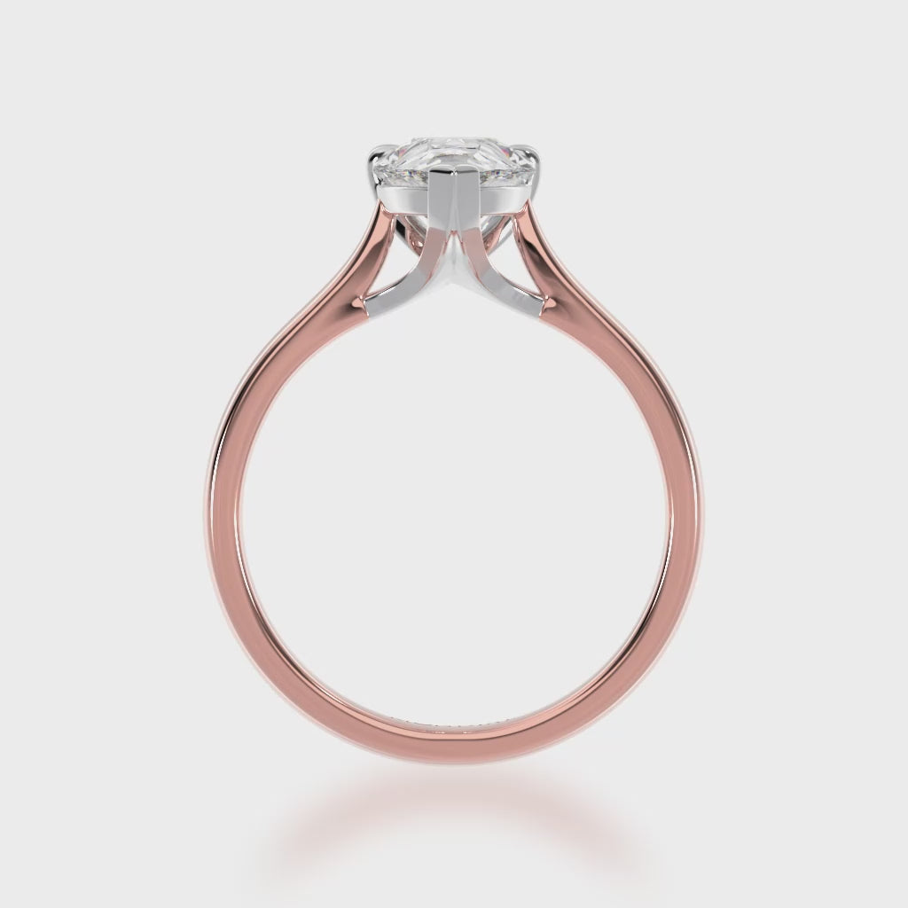 Pear shaped diamond solitaire ring on rose gold band