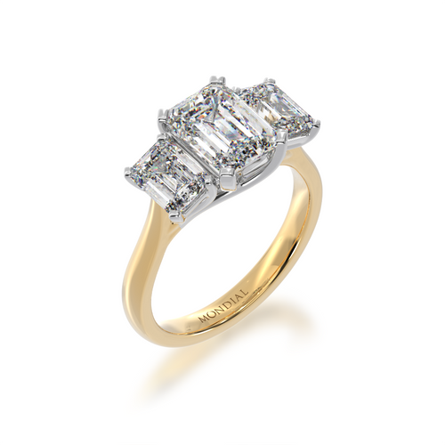 Trilogy emerald cut diamond ring on yellow gold band view from angle
