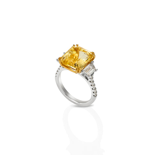 Emerald cut yellow sapphire and trapezoid diamond ring