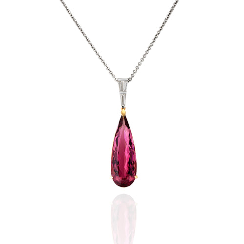 Elongated pear shape pink tourmaline and tapered baguette diamond pendant