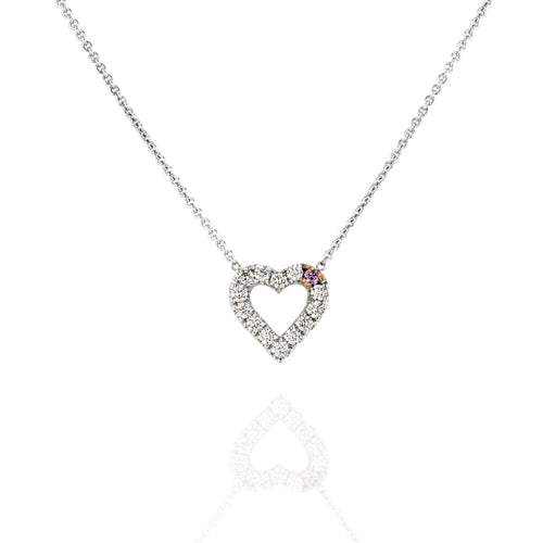 Heart-shaped diamond necklace on a white background