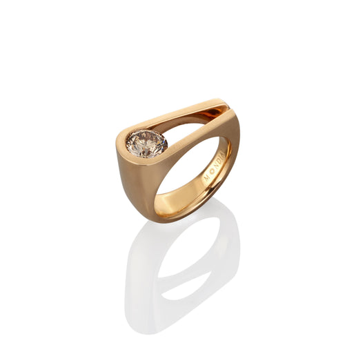 Contemporary Gold engagement ring with an argyle champagne diamond on a white background