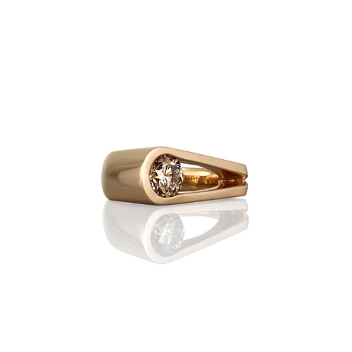 Contemporary Gold engagement ring with an Argyle champagne diamond shown from a side view.