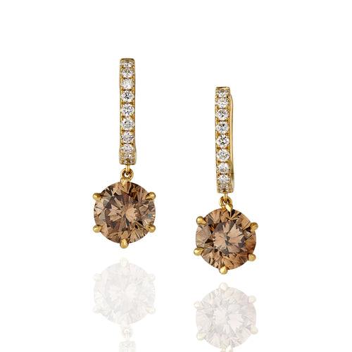 Gold hoop earrings with argyle champagne diamond drop with white diamonds on upper hoop, photographed on a white background