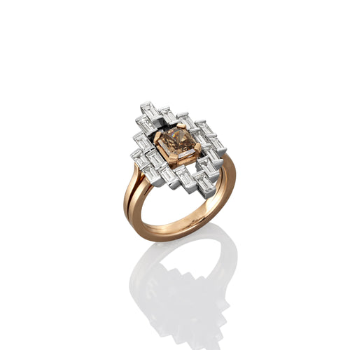 Ring with a brown diamond and white gemstones on a white background
