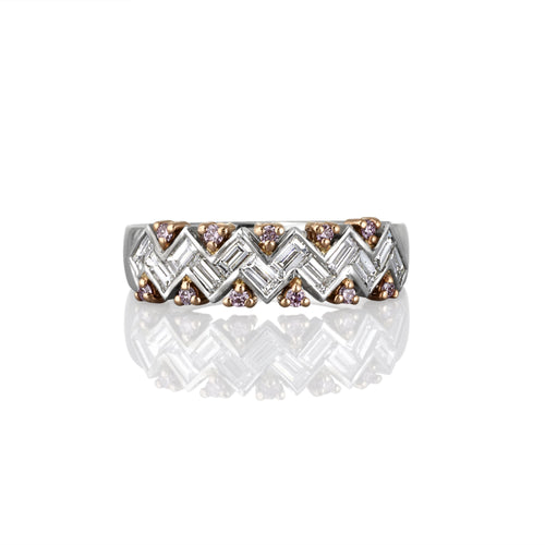 Elegant ring with a chevron pattern and argyle pink diamonds on a white background