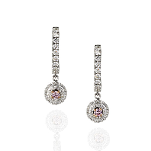 Pair of diamond drop earrings with a central Argyle pink gemstone on a white background