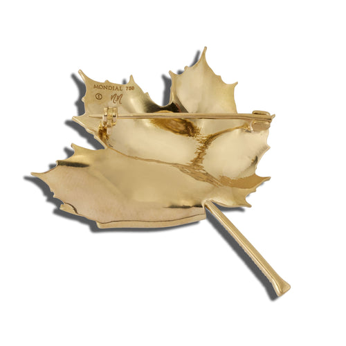 Back view of gold autumn fold brooch showing the pin clasp on a white background.
