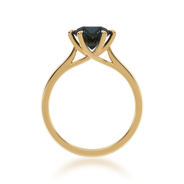 Brilliant cut black sapphire solitaire on a yellow gold band from front