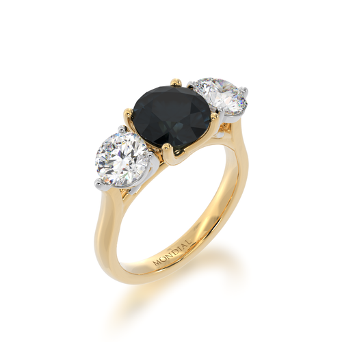 Trilogy round brilliant cut black sapphire and diamond ring on yellow band