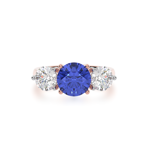 The Mondial by Nadia Round Brilliant cut trilogy blue Sapphire engagement ring with diamonds on rose gold band view from top.