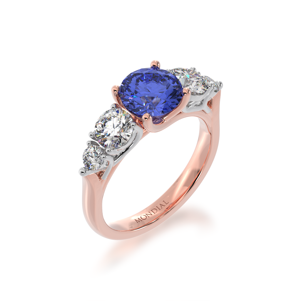 Five stone round blue sapphire and white diamond ring from angle