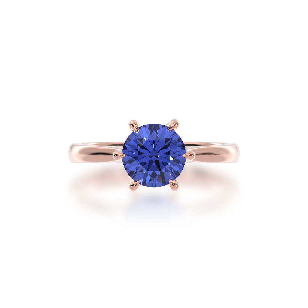 Brilliant cut blue sapphire solitaire on a rose gold band from top