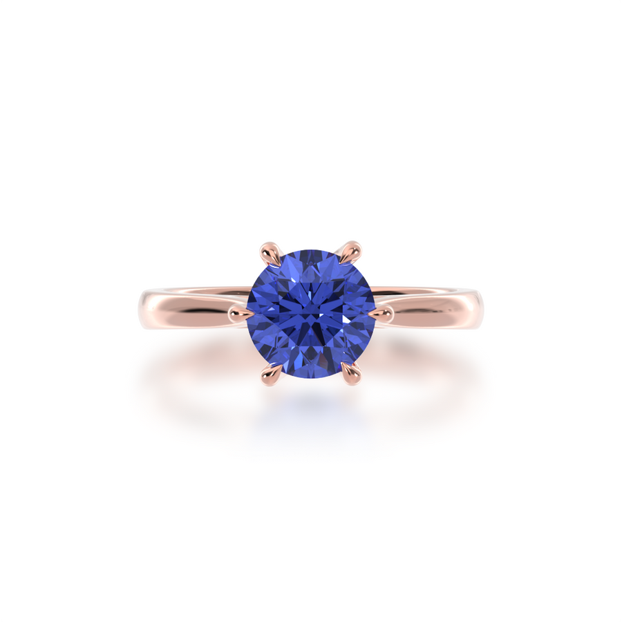 Brilliant cut blue sapphire solitaire on a rose gold band from top