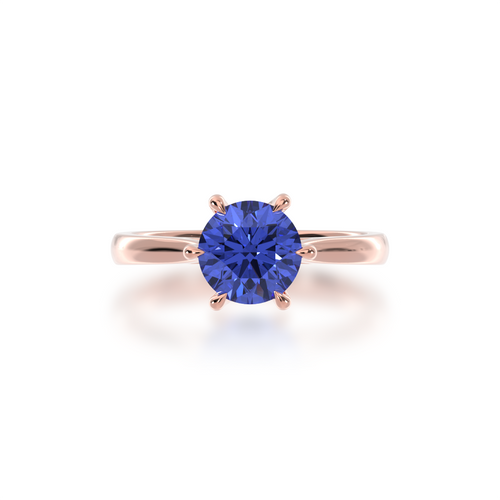 Brilliant cut blue sapphire engagement ring solitaire design on a rose gold band by Mondial by Nadia from top.