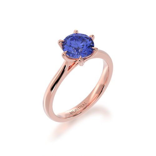 Brilliant cut blue sapphire engagement ring solitaire design on a rose gold band by Mondial by Nadia from side.