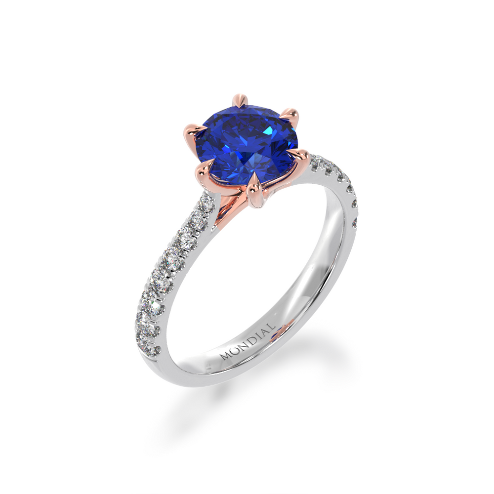 Round brilliant cut blue sapphire solitaire ring with diamond set band view from angle 