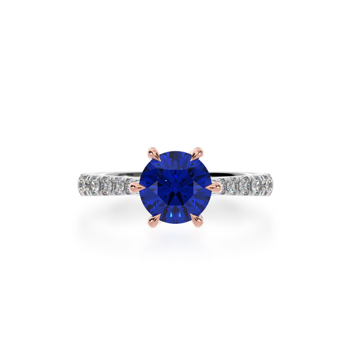 The Mondial by Nadia Round brilliant cut solitaire blue sapphire engagement ring with diamond set band view from top.