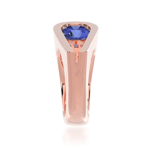 The Mondial by Nadia Retro design round brilliant cut blue Sapphire engagement ring in rose gold view from side.