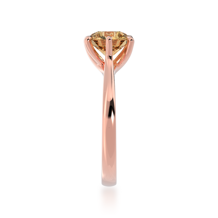 Brilliant cut champagne diamond solitaire on a rose gold band from side