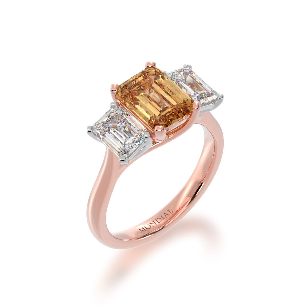 Trilogy emerald cut champagne and diamond ring on rose gold band view from angle 