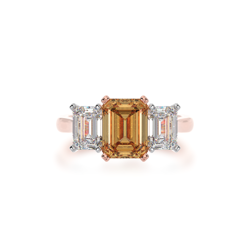 Trilogy emerald cut champagne and diamond ring on rose gold band view from top