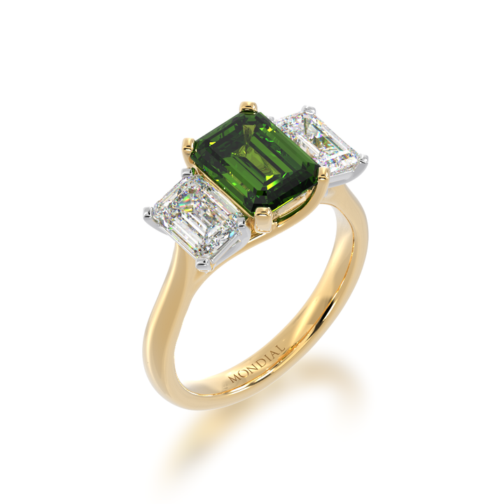 Trilogy emerald cut green sapphire and diamond ring on yellow gold band
