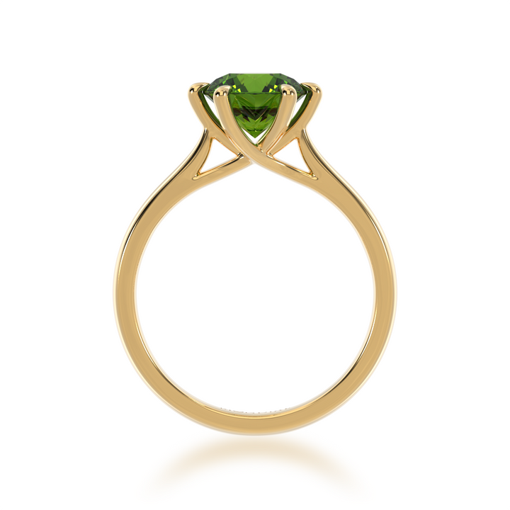 Brilliant cut green sapphire solitaire on a yellow gold band from front