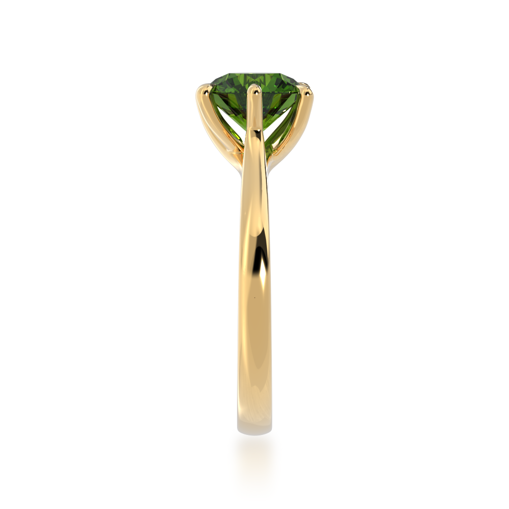 Brilliant cut green sapphire solitaire on a yellow gold band from side