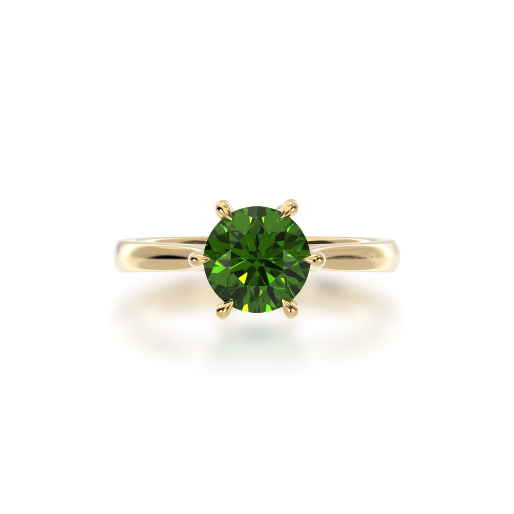 Brilliant cut green sapphire solitaire on a yellow gold band from top