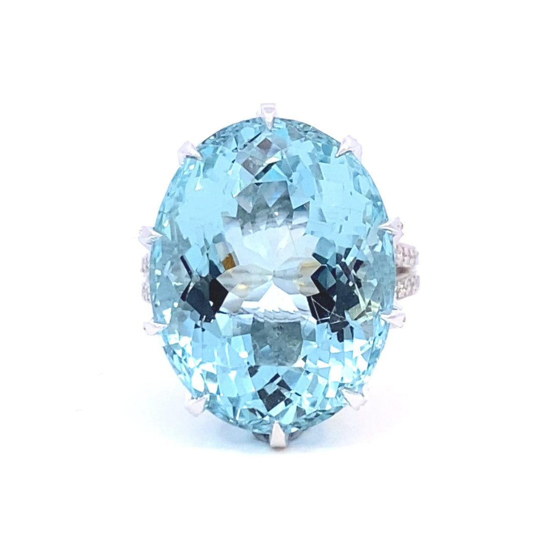 Aquamarine cocktail ring set with a cross hatched diamond basket view from front 