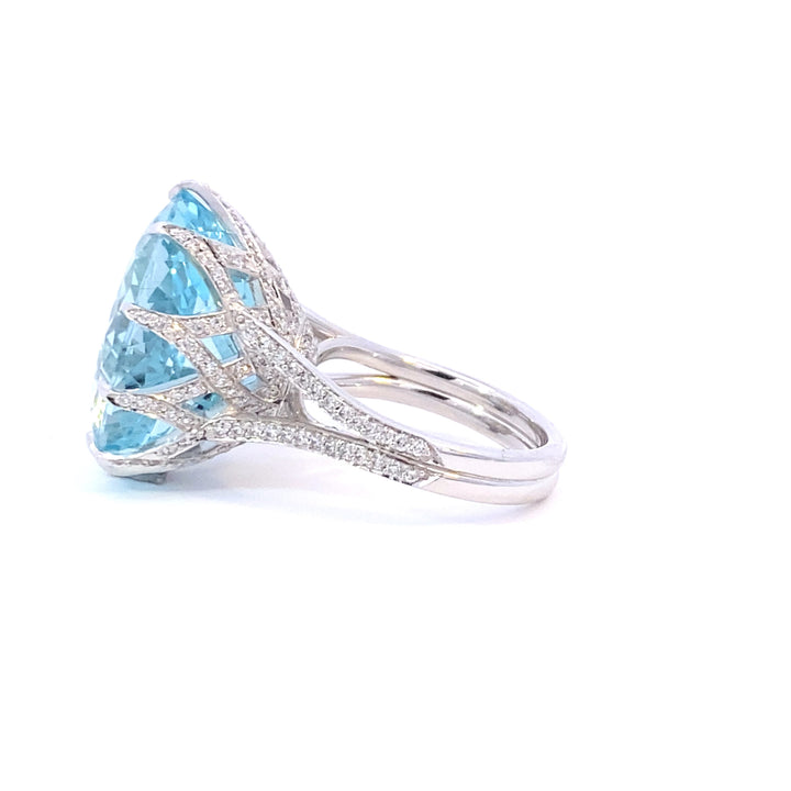 Aquamarine cocktail ring set with a cross hatched diamond basket view from side 
