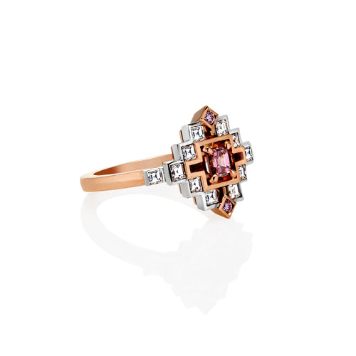 Lumiere Collection inner element of the multi piece ring shown resting on its side. The ring consists of White Diamonds and Pink Sapphires. It has a rose gold band and white gold stone setting.