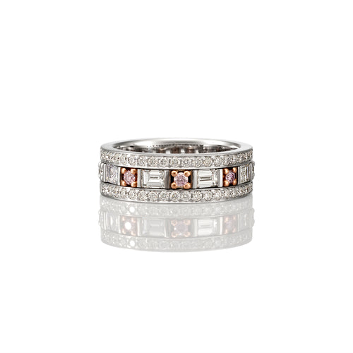 White Gold thick band ring with Brilliant cut white diamonds the full circumference of the ring on the first layer, Emerald cut white diamonds and brilliant cut pink sapphires on the second row and again with Brilliant cut white diamonds on the third row.