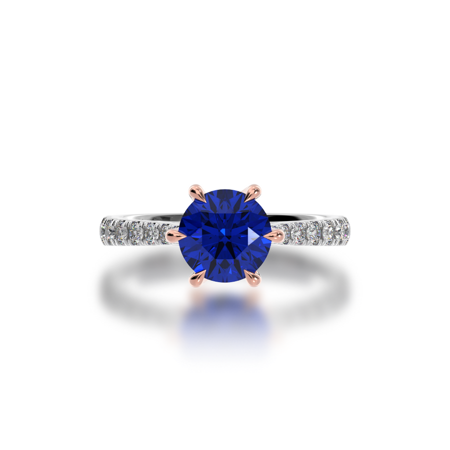 Front view of the Mondial by Nadia Round Brilliant cut Blue Sapphire engagement ring with a diamond set band.